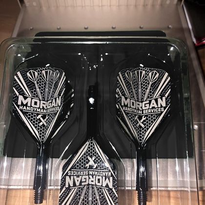 Three black flights engraved with the Morgan Handyman Services logo, in their tray