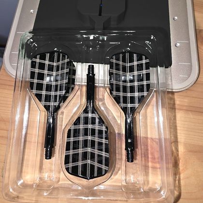Three black flights engraved in a white tartan check