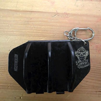 The Funky Gibbon logo engraved on a dart case