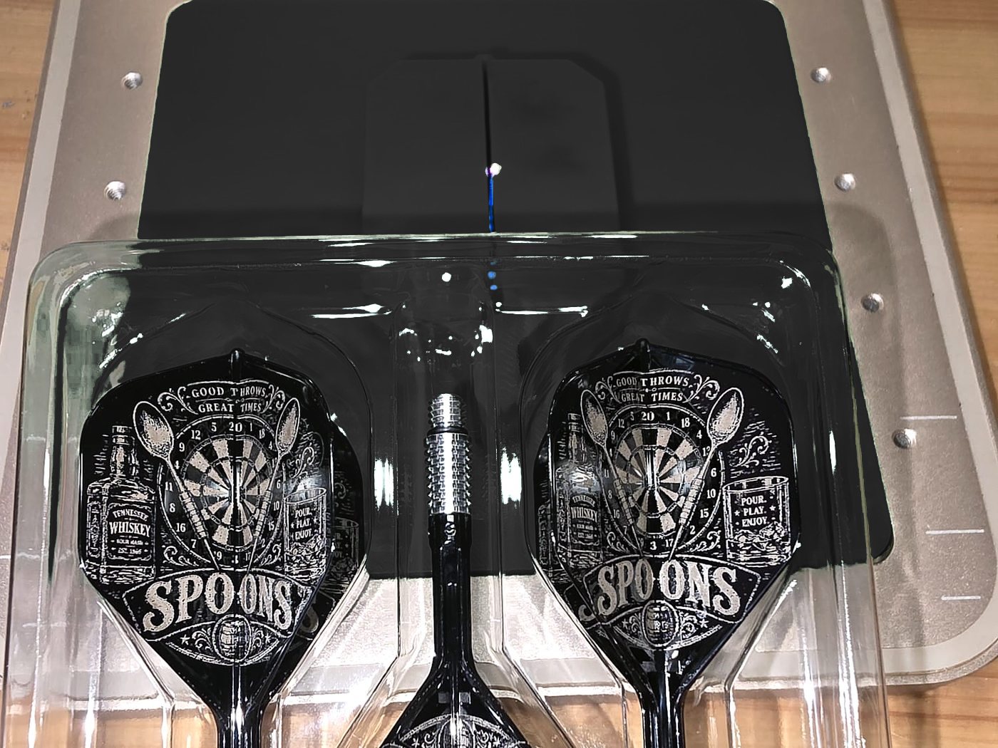 A set of three black flights engraved with a Spoons darts team design of a dartboard, pints and darts
