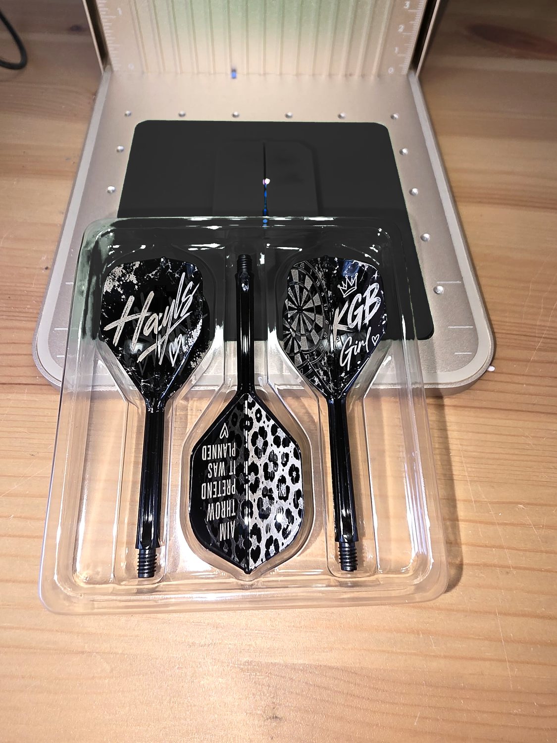 A mixed set reading Hayls and KGB Girl, with a leopard print flight